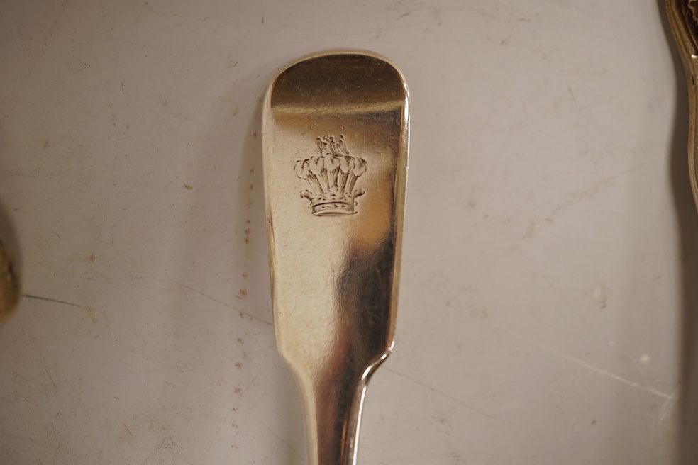 A George III silver fiddle pattern stilton scoop, John Lias, London, 1816, 20cm, together with two Georgian silver sauce ladles, a similar sifter ladle and a William IV shell pattern fish knife, 8.9oz.